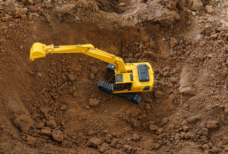 Excavators loader are digging the soil in the construction site ,top viewの写真素材