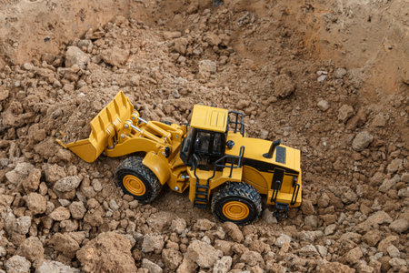 Wheel loader are digging the soil in the construction site ,side view