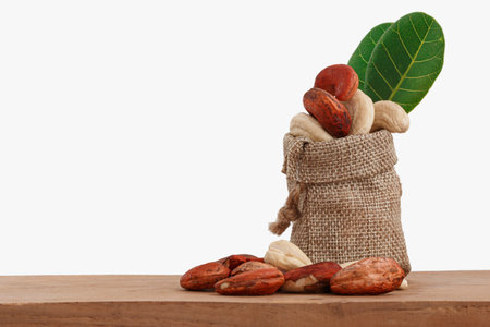 Cashew nuts raw with green leaf in bag
