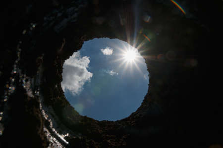 A beam of light from the sun with blue sky,Through the tunnelの写真素材
