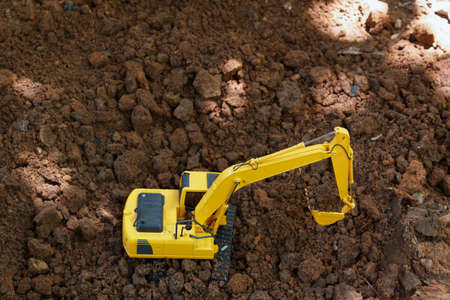 Yellow Excavators are digging the soil in the construction site,Top viewの写真素材