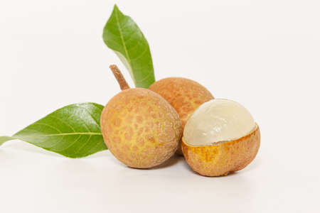 Fruit fresh longan with leaf   on white background,close upの写真素材