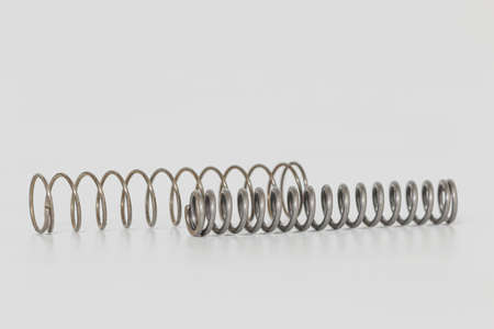 Spring steel push design on white backgroundの写真素材