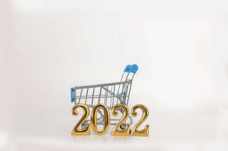 New Year Concept 2022 , With shopping trolley on a white background.の写真素材