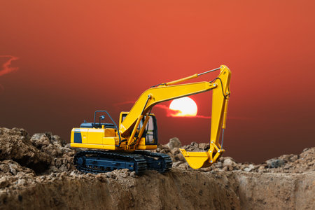 Crawler excavators are digging the soil in the construction site on  sunset background