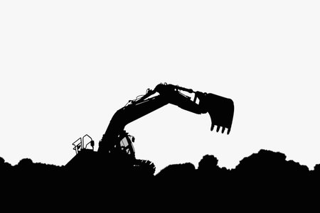 Excavators silhouette are digging the soil in the construction site  on the  white backgroundの写真素材