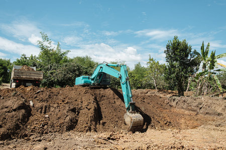 Crawler excavators are digging the soil ,dig a pond in the construction site location field