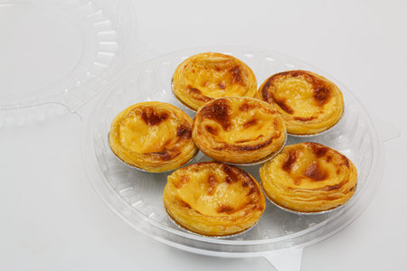 egg tart sweet custard pie in foil cup  on white background,with packaging ready to ship