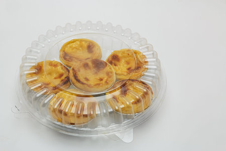 egg tart sweet custard pie in foil cup  on white background,with packaging ready to ship