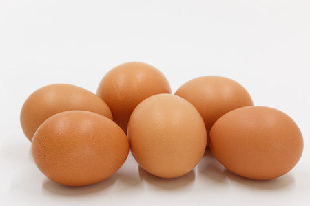 Six chicken egg raw on a white background.の写真素材