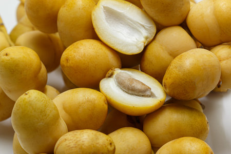 Pile of tasty sweet fresh dates isolated on white background. ,close upの写真素材