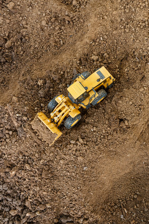Wheel loader are digging  soil in the construction site ,Top view