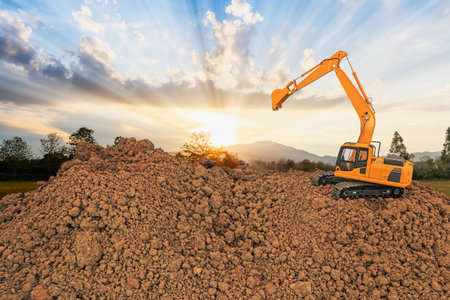 Crawler Excavators with bucket lift up in the construction site on the sunset  backgrounds.