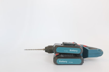 Lithium battery of cordless drill on white background.For drilling or tightening workの写真素材