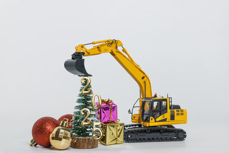 Concepts happy new year 2025 ,With Crawler excavator and bucket lift up on white background.の写真素材