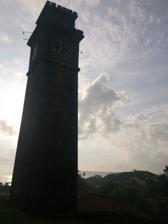 Bottom view of a clock towerの写真素材