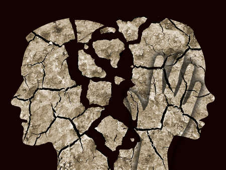 Divorce couple, cracked earth concept. Stylized man and woman crumbling silhouettes symbolizing divorce.の写真素材