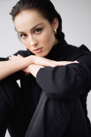 Good series of photos of young pretty woman. studio. European type, big lips, awesome eyes, slim body. white background. black clothes. Emotional. minimalism. style. fashionable and modern lifestyleの写真素材