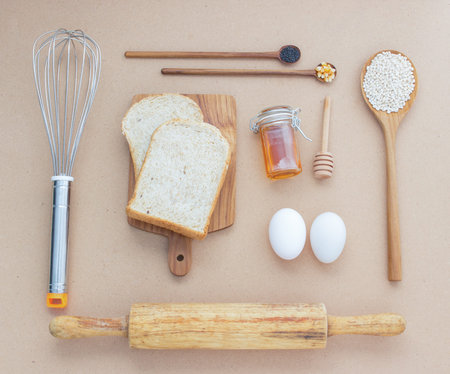 Baking Equipment make Bread wheat grains and cereals on wooden background
