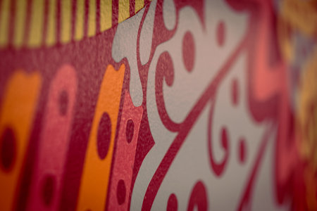 focus on the rich and intricate pattern of a vintage textile with vibrant colors and detailed designの写真素材