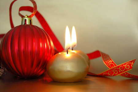 christmas ornaments and burning candlesの写真素材