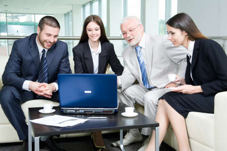 Business group meeting portrait - four business people working together.の写真素材