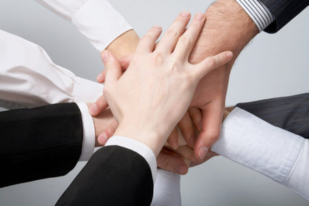 Hands on top of each other. Symbolic picture. 