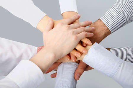 Hands on top of each other. Symbolic picture. 
の写真素材