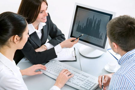 Image of successful partners discussing business plan at meeting