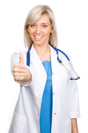 Friendly female doctor with thumbs up - isolated over white 
の写真素材