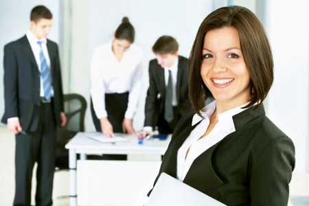 Young business woman with her colleagues