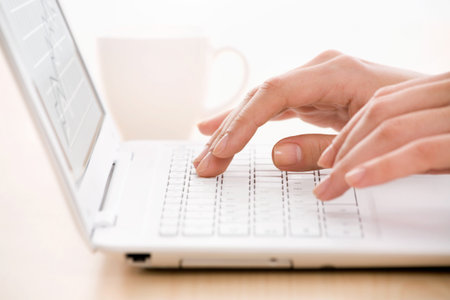 Woman's hands and laptop