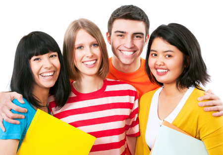 Happy young teenager students standing and smiling with booksの写真素材