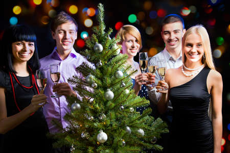 Portrait of several friends celebrating New Yearの写真素材