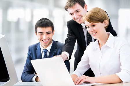 Portrait of a group of business people working together at a meeting