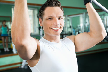 Man with weight training equipment on sport gym club