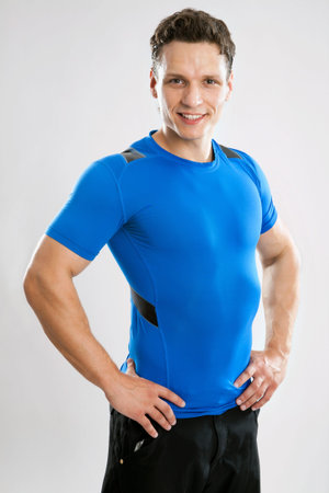 Man fitness model on a gray backgroundの写真素材