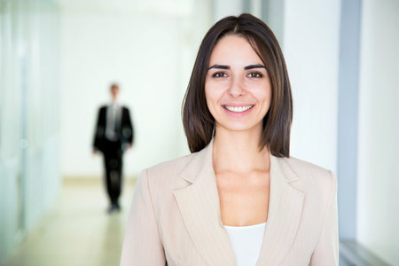 Business woman walking in the office corridor