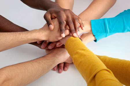Closeup of business team putting their hands on top of each otherの写真素材