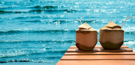 Romantic cocktail of coconuts on the beach