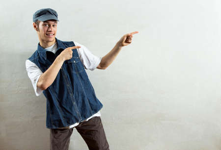 Funny young man advertises somethingの写真素材