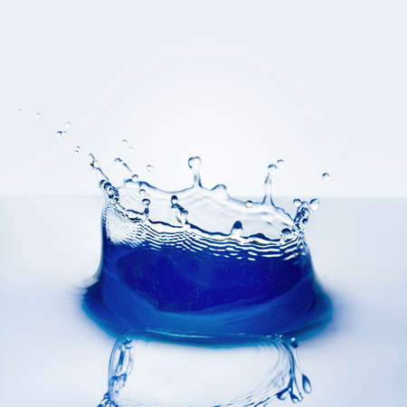 Beautiful splash of water falling from a slice of lemonの写真素材