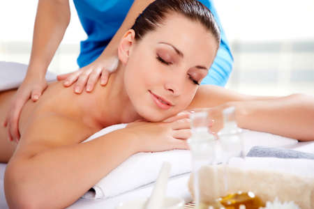 Healthy life. Young beautiful woman relaxed in spa environmentの写真素材