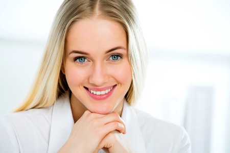 Closeup portrait of cute young business woman smilingの写真素材