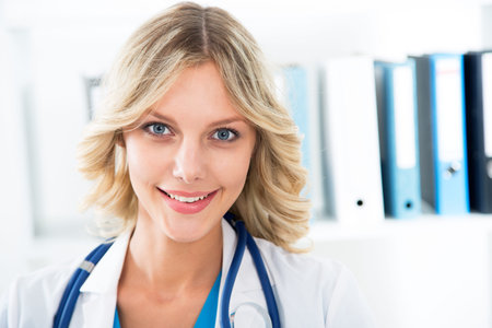 Closeup portrait of young female doctorの写真素材