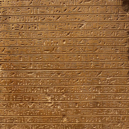 Old egypt hieroglyphs carved on the stoneの写真素材