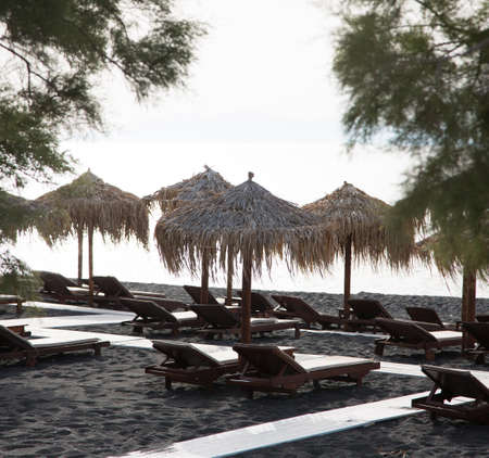 Beach of black sand under morning sunの写真素材