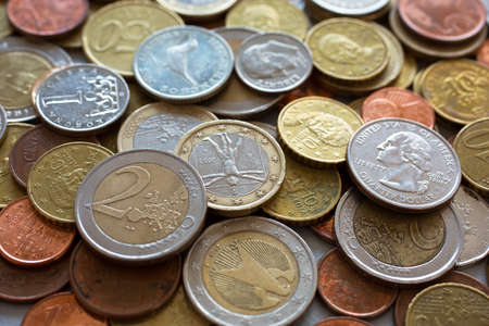 Lot of coins from different countries. Background and textureの写真素材