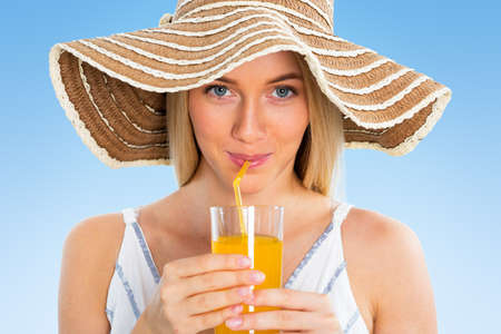 Pretty woman with orange juiceの写真素材