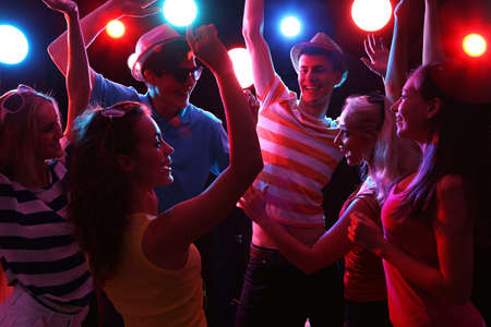 Young people having fun dancing at party.